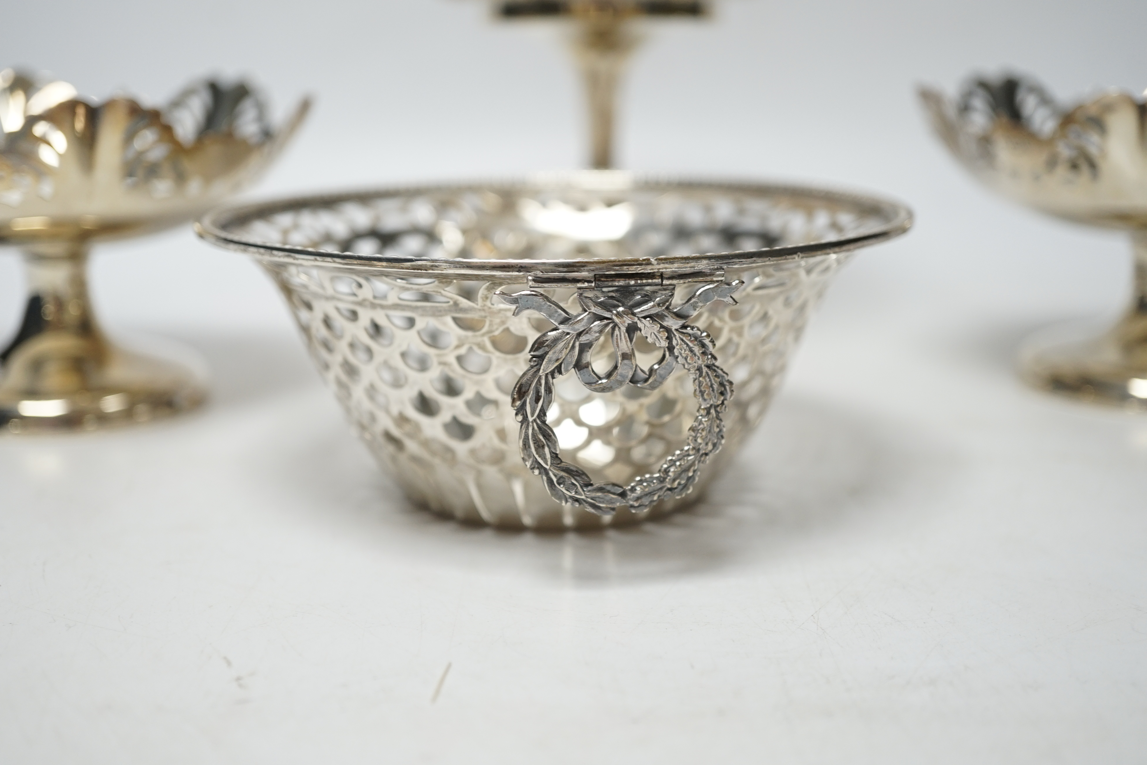 A pair of George VI pierced silver pedestal bon bon dishes, Viners Ltd, Sheffield, 1947, 11.7cm and three other assorted silver bonbon dishes, one with ring handles.